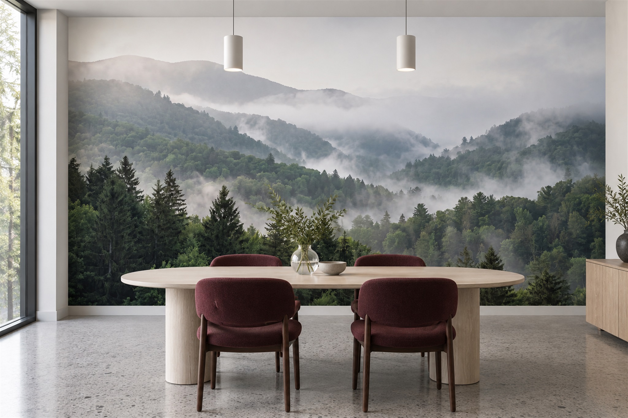 Misty green forest mural behind an oval dining table and four plum chairs