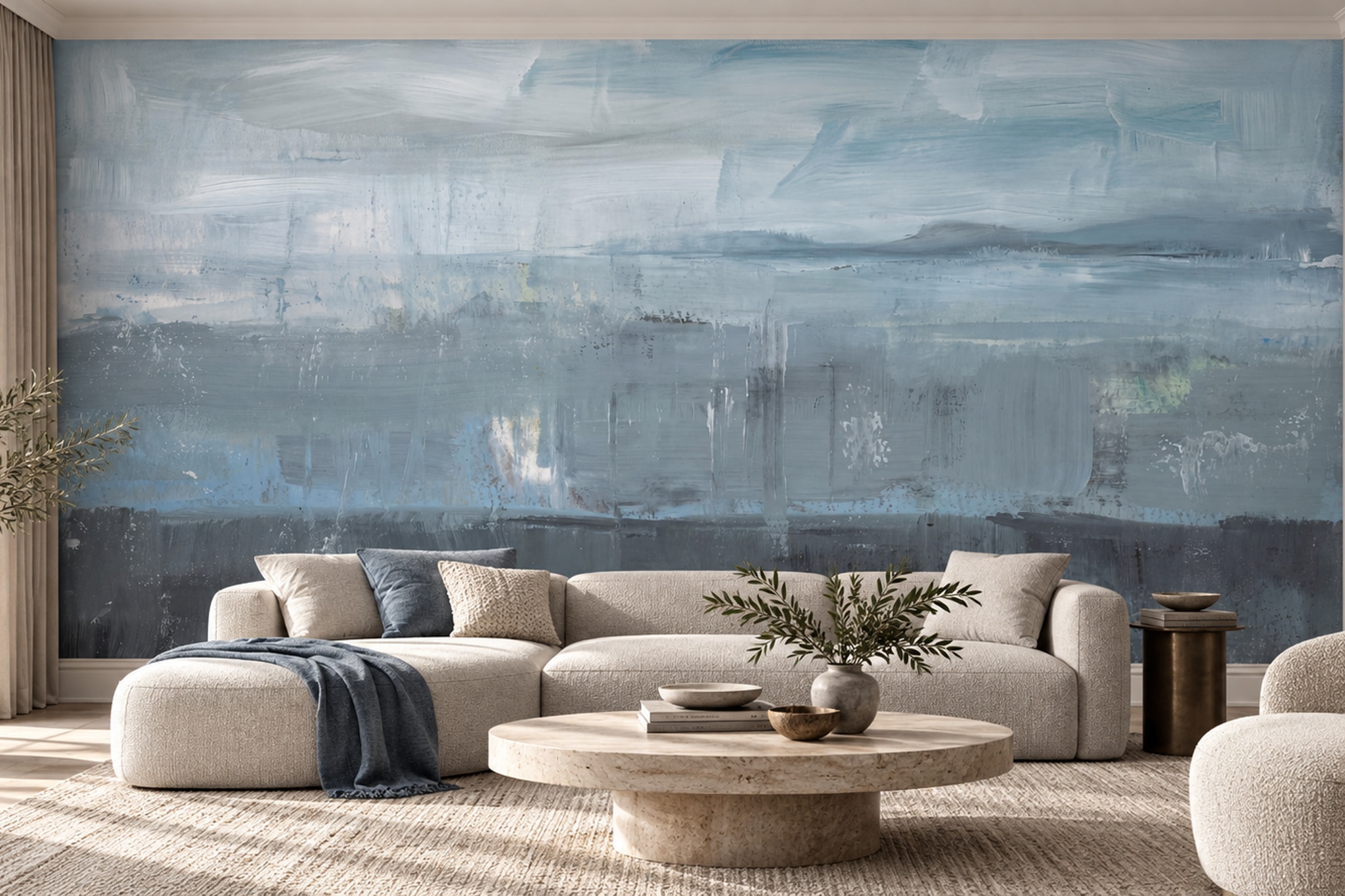 Living room with a cream sofa before a blue-grey painterly abstract mural with broad horizontal brush marks